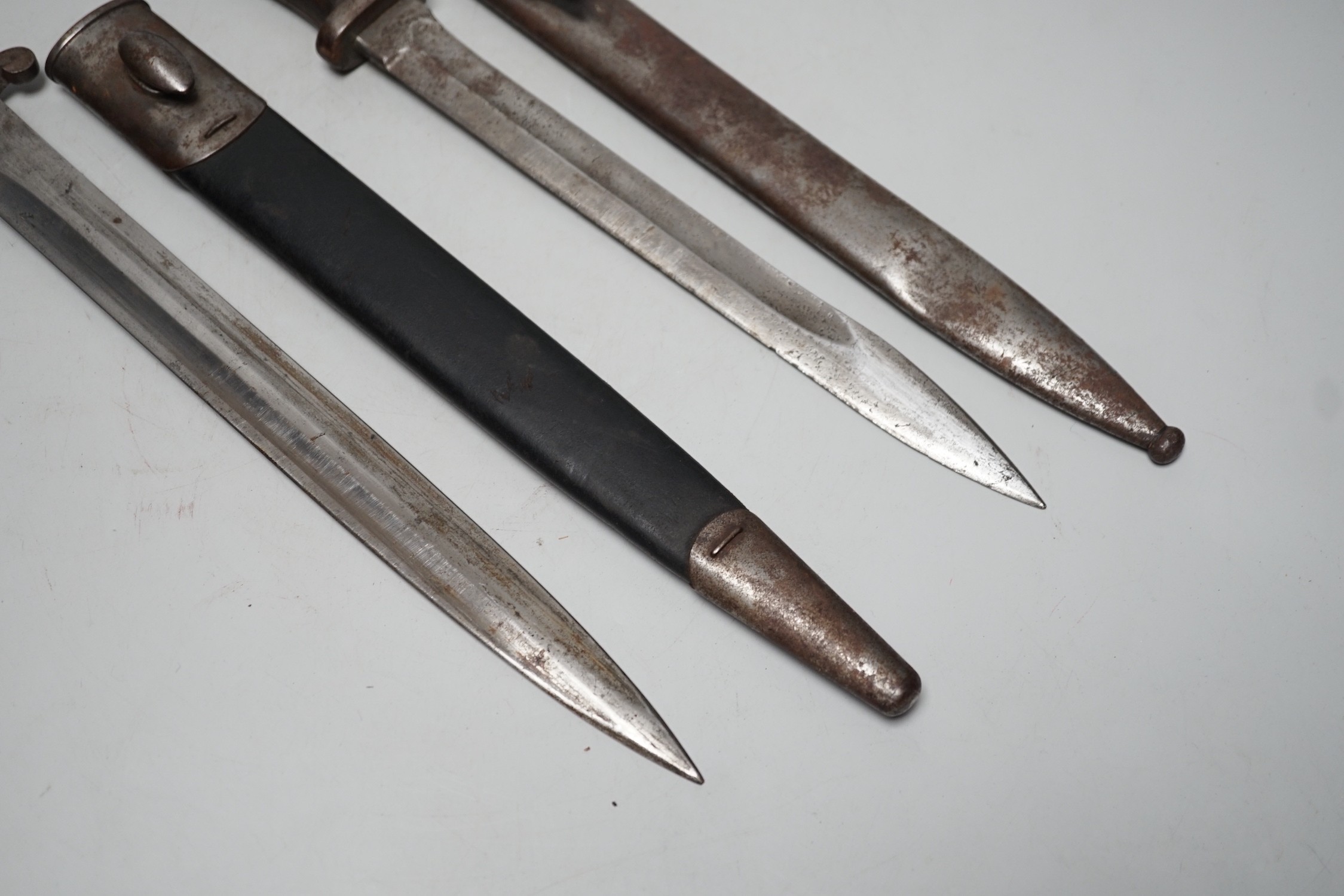 A 19th century British bayonet and scabbard together with a German bayonet and scabbard, the blade stamped Gottlieb Hammesfahr Solingen Foche